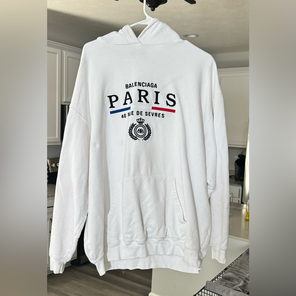 Balenciaga all white hoodie size large.  No stains!!!  The strings are missing.